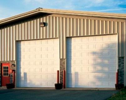 Puerta seccional de acero Thermacore 594 (uso medio)